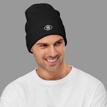 Man wearing a black beanie with a white leye ogo on a white background