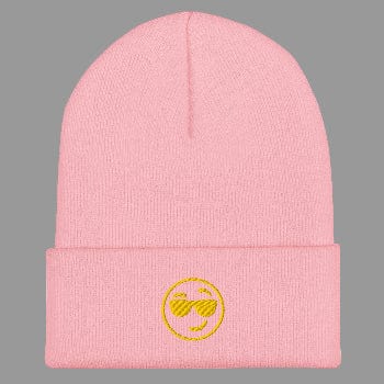 Pink beanie with a yellow smiley face design on a white background