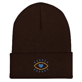 Brown beanie with an embroidered design on a white background