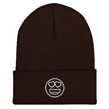 Brown beanie with a white emoji design on a white background