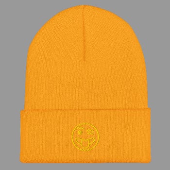 Yellow beanie with a smiley face emblem on a white background