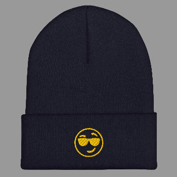 Black beanie with a yellow smiley face design on a white background