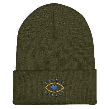 Green beanie with an embroidered design on a white background
