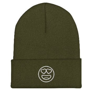 Green beanie with a white emoji design on a white background