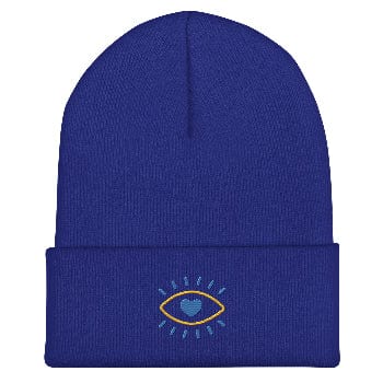Blue beanie with a embroidered design on a white background