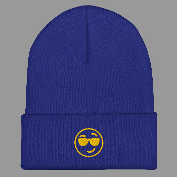 Blue beanie with a yellow smiley face design on a white background