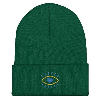 Green beanie with an embroidered design on a white background