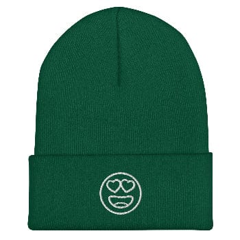 Green beanie with a white emoji design on a white background