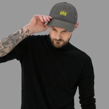 Man wearing a gray cap with a yellow logo on a light gray background