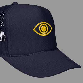 Navy blue trucker cap with yellow eye logo on a white background
