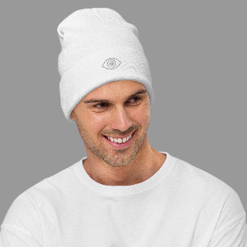 Man wearing a white beanie with a logo on a white background