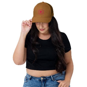 Woman wearing a brown cap with a logo on a white background