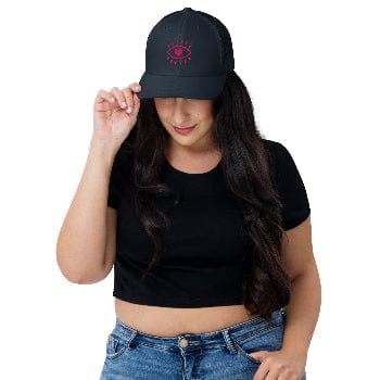Woman wearing a black cap with a red logo on a white background