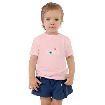Child wearing a pink shirt with a Love design(HeartSight) and navy shorts on a white background