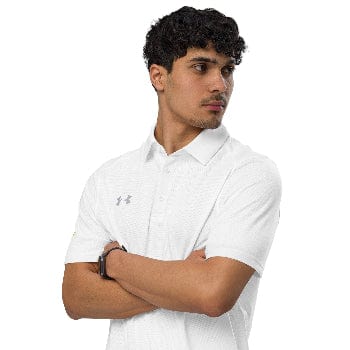Man wearing a white Under Armour polo shirt with arms crossed on a white background