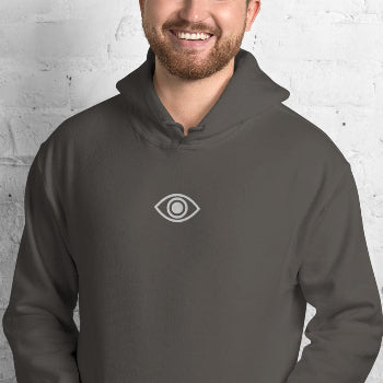 Man wearing a dark gray hoodie with an eye logo on a light gray background