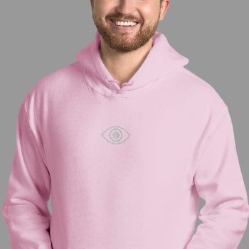 Person wearing a pink hoodie with a small eye logo on a light gray background