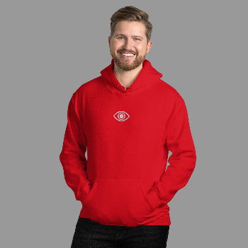 Man wearing a red hoodie with a logo against a white brick wall