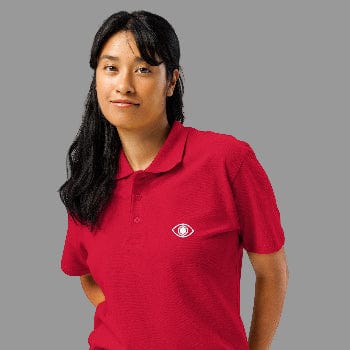 Person wearing a red polo shirt with a logo on a white background